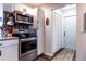 Updated kitchen with stainless steel appliances, granite countertops, and ample cabinet space at 2057 Hillview Circle, Deltona, FL 32738
