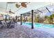Screened-in pool with outdoor dining area for relaxing and entertaining at 2057 Hillview Circle, Deltona, FL 32738