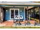 Cozy front porch features a charming swing, creating a welcoming entryway at 2057 Hillview Circle, Deltona, FL 32738
