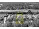 Monochrome aerial view of home outlined in yellow with green backyard at 212 Stonington Way, Deland, FL 32724