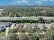 Aerial view of residential area, highlighting the roof and surrounding landscape at 212 Stonington Way, Deland, FL 32724