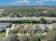 Aerial view of neighborhood homes; highlighted property has well maintained lawn at 212 Stonington Way, Deland, FL 32724