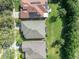 Overhead view of suburban homes with well-maintained lawns and mature trees at 212 Stonington Way, Deland, FL 32724