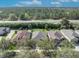 Aerial view of homes with lush trees and landscaping along a highway at 212 Stonington Way, Deland, FL 32724
