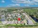 An aerial view of the neighborhood featuring beautiful lush landscaping with a pond in the background at 212 Stonington Way, Deland, FL 32724