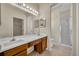 Bathroom featuring double sink vanity with storage space, tile flooring and walk-in shower at 212 Stonington Way, Deland, FL 32724