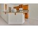 Kitchen breakfast bar featuring granite countertops and wood cabinetry at 212 Stonington Way, Deland, FL 32724