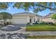 Charming single-story home with a well-manicured lawn and a two-car garage at 212 Stonington Way, Deland, FL 32724