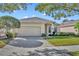Charming single-story home with a well-manicured lawn and a two-car garage at 212 Stonington Way, Deland, FL 32724