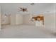 Spacious living room with neutral carpet, open to the kitchen area at 212 Stonington Way, Deland, FL 32724