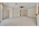 Expansive living room featuring neutral carpet, archways, and plenty of natural light at 212 Stonington Way, Deland, FL 32724