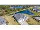 Picturesque aerial shot featuring a well-maintained single Gathering home with a spacious backyard and pond access at 2236 Oconnel Dr, Ormond Beach, FL 32174