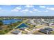 Expansive aerial view of homes and the community pond at 2236 Oconnel Dr, Ormond Beach, FL 32174