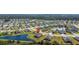 Sprawling aerial view showcasing a residential community with various homes, ponds, and scenic surroundings at 2236 Oconnel Dr, Ormond Beach, FL 32174