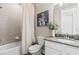 This lovely bathroom features a tub with a tiled wall, a toilet, and a vanity at 2236 Oconnel Dr, Ormond Beach, FL 32174