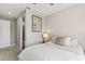 This bedroom has a plush bed and an ensuite bathroom at 2236 Oconnel Dr, Ormond Beach, FL 32174