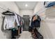 Walk-in closet with metal shelving full of clothes and shoes, and a safe for secure storage at 2236 Oconnel Dr, Ormond Beach, FL 32174