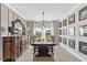 Inviting dining room boasts a large table, elegant decor, and plenty of natural light at 2236 Oconnel Dr, Ormond Beach, FL 32174