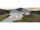 Beautiful single Gathering home with a two-car garage, long driveway, and pristine landscaping at 2236 Oconnel Dr, Ormond Beach, FL 32174