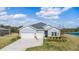 Charming single Gathering home with a two-car garage, long driveway, and pristine landscaping at 2236 Oconnel Dr, Ormond Beach, FL 32174
