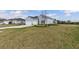 Beautiful single-story home with a three-car garage and lush green lawn at 2236 Oconnel Dr, Ormond Beach, FL 32174