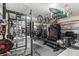 Gym in the garage has weightlifting equipment and organization for workout routines at 2236 Oconnel Dr, Ormond Beach, FL 32174