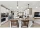 Spacious kitchen features a large island with seating, stainless appliances, and white cabinetry at 2236 Oconnel Dr, Ormond Beach, FL 32174