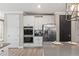 Bright kitchen features white cabinetry, stainless steel appliances, and a gray countertop island at 2236 Oconnel Dr, Ormond Beach, FL 32174