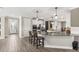 Spacious kitchen features a large island with seating, stainless appliances, and white cabinetry at 2236 Oconnel Dr, Ormond Beach, FL 32174