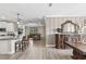 Open concept living area with kitchen island, dining area, and comfortable seating at 2236 Oconnel Dr, Ormond Beach, FL 32174