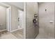 Modern shower with stylish tile, recessed shelves, and a sleek showerhead, showing an elegant design at 2236 Oconnel Dr, Ormond Beach, FL 32174