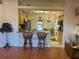 Inviting kitchen with granite counters, breakfast bar seating, and stainless steel appliances at 2327 Addison Ave, Clermont, FL 34711