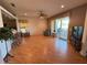 Inviting living room featuring hardwood flooring, sliding glass doors leading to a patio, and comfortable seating at 2327 Addison Ave, Clermont, FL 34711