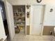 Pantry includes shelving for organized storage at 2327 Addison Ave, Clermont, FL 34711