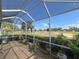 Relaxing screened-in patio with clear views of the golf course at 2327 Addison Ave, Clermont, FL 34711