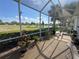 Relaxing screened-in patio with views of the pond and golf course at 2327 Addison Ave, Clermont, FL 34711