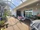 Screened patio offers space for outdoor entertaining and dining at 2327 Addison Ave, Clermont, FL 34711