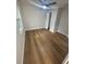 Bedroom featuring hardwood floors, a ceiling fan, and a closet at 266 N High St, Lake Helen, FL 32744