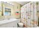 Bright bathroom featuring a decorative shower curtain at 2711 N Halifax Ave # 890, Daytona Beach, FL 32118