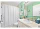 Cozy bathroom features a vanity with storage, and a shower with white shower curtain at 2711 N Halifax Ave # 890, Daytona Beach, FL 32118