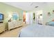 Cozy bedroom with bright paint featuring a dresser and adjacent rooms at 2711 N Halifax Ave # 890, Daytona Beach, FL 32118