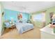 Bright bedroom featuring a comfortable bed, ceiling fan, and a bright sunny window at 2711 N Halifax Ave # 890, Daytona Beach, FL 32118