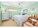 Charming bedroom featuring nautical themed decor and comfortable seating area with wicker chairs at 2711 N Halifax Ave # 890, Daytona Beach, FL 32118