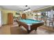Relaxing billiards room featuring a pool table, shelving, and window overlooking the outdoors at 2711 N Halifax Ave # 890, Daytona Beach, FL 32118