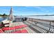 Comfortable deck area with outdoor seating and a grill, perfect for relaxing and enjoying waterfront views at 2711 N Halifax Ave # 890, Daytona Beach, FL 32118