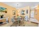 Dining area with glass table and seating, adjacent to the kitchen and living room at 2711 N Halifax Ave # 890, Daytona Beach, FL 32118