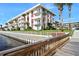 Building exterior with well-maintained landscaping, waterfront proximity, and architectural details at 2711 N Halifax Ave # 890, Daytona Beach, FL 32118