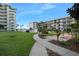 Beautifully landscaped grounds with lush green grass, mature trees, and sidewalks, creating a serene environment at 2711 N Halifax Ave # 890, Daytona Beach, FL 32118