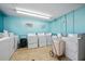Clean laundry room with rows of well-maintained washing machines and laundry carts at 2711 N Halifax Ave # 890, Daytona Beach, FL 32118