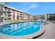 Inviting outdoor pool with a spacious deck and lounge chairs, providing a perfect spot for relaxation and recreation at 2711 N Halifax Ave # 890, Daytona Beach, FL 32118